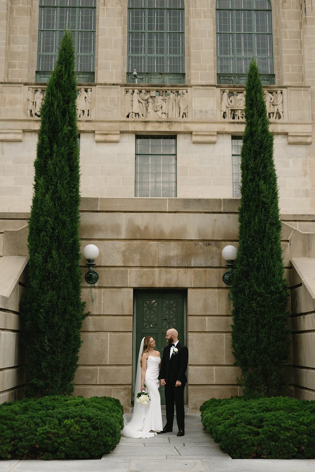 Bride and groom portraits at the Nebraska State Capitol building in Lincoln, Nebraska — Nebraska elopement photographer Britt McNeil